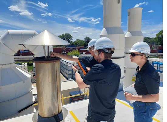 students using equipment on roof